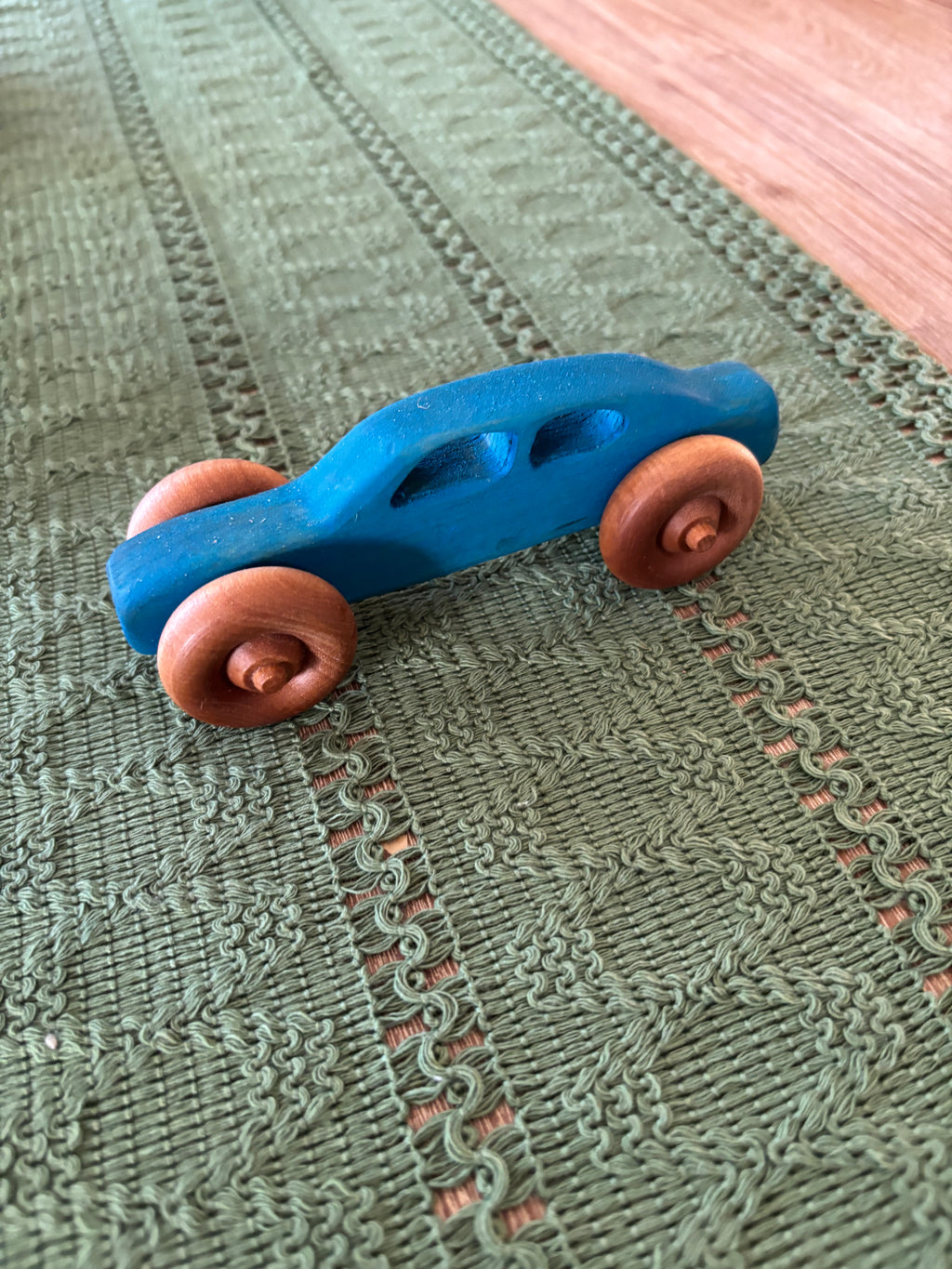 Ready to Ship, Push Cars, 10 Colours / Styles showcasing a handcrafted blue wooden toy car with smooth natural wood wheels, crafted as unique homeschool educational resources and wood toys.