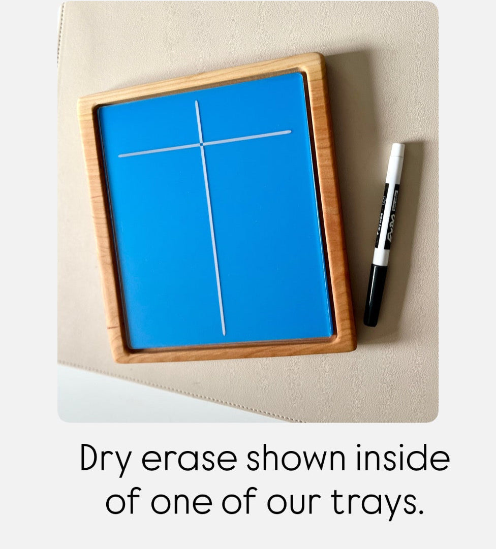 Small rectangular wooden tray with blue dry erase board and black dry erase marker on beige surface