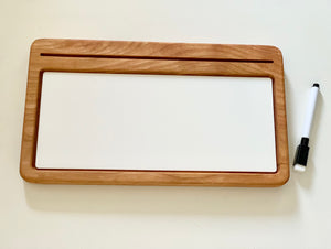 Rectangular wooden writing tray with white dry erase board and black marker on light background