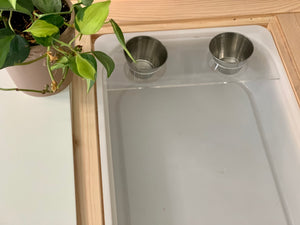 Maple edge piece Tinker Pot Flisat table top insert with clear acrylic tray and two small metal cups next to green plant
