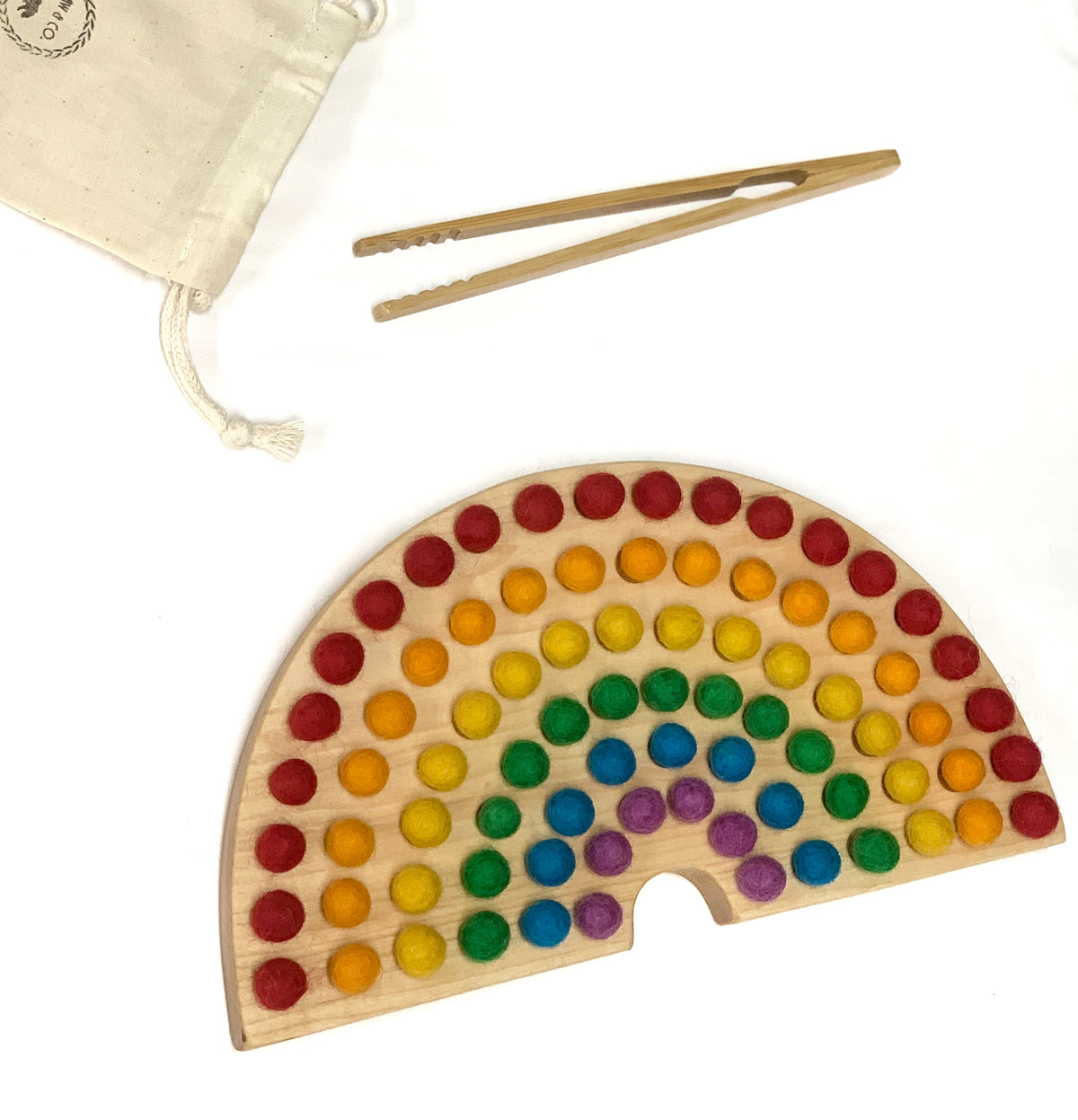 Canadian Cherry Hardwood rainbow sorting board with colorful felt balls, wooden tweezers, and a fabric drawstring bag on white background