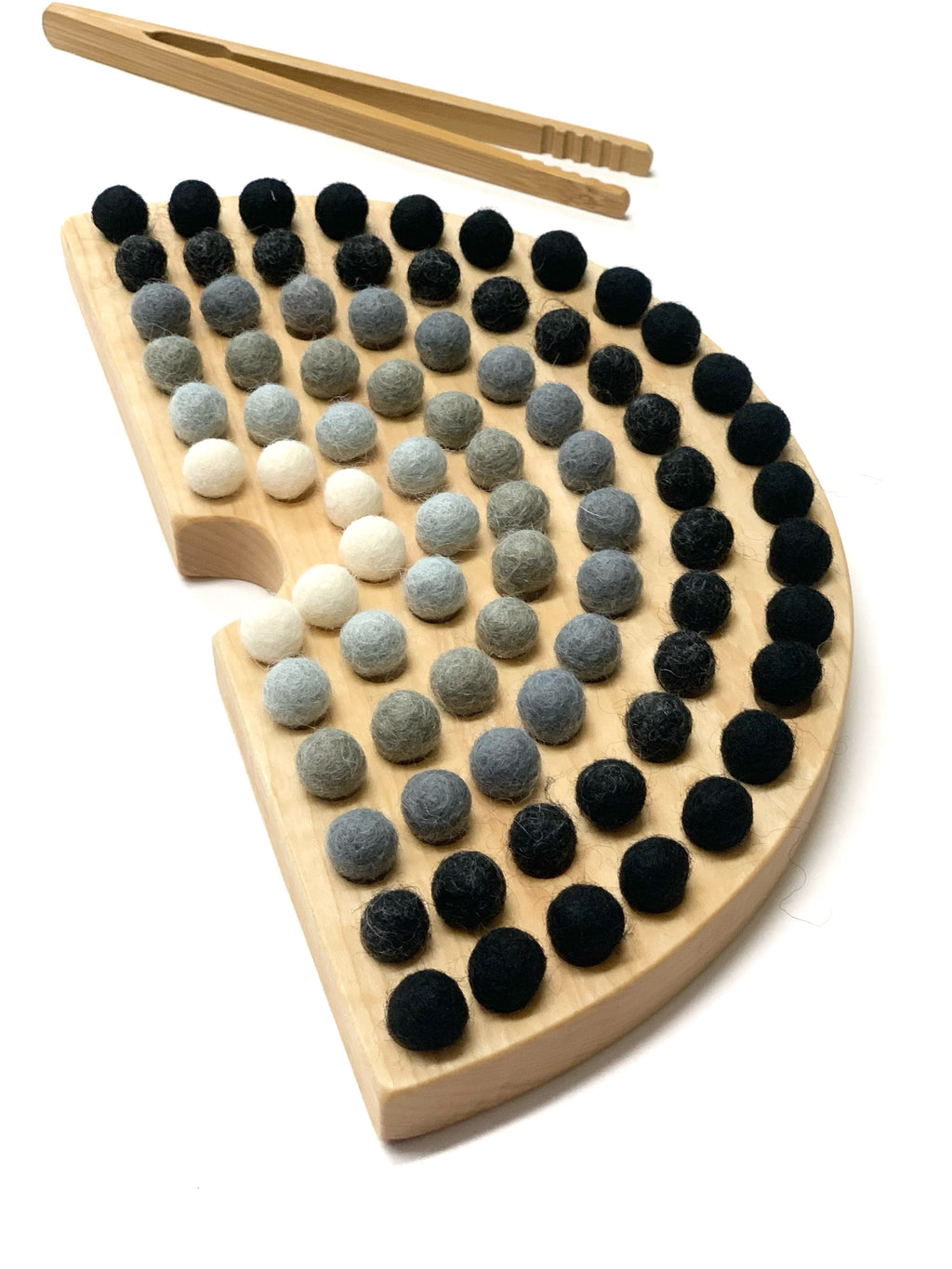 Canadian Cherry Hardwood rainbow sorting board with engraved holes, wool felt balls in neutral shades, and wooden tongs