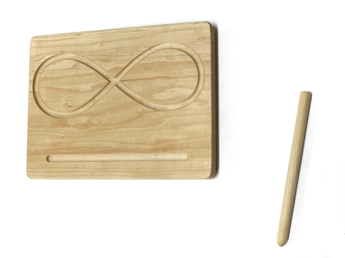 Canadian maple wooden infinity board with engraved figure eight tracing path and wooden stylus on white background