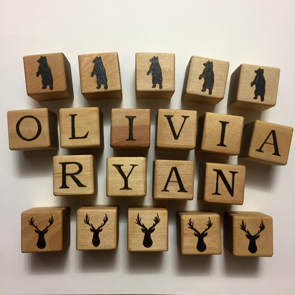Custom 2 inch wooden blocks personalized with letters and bear and deer silhouettes for decoration or gifts