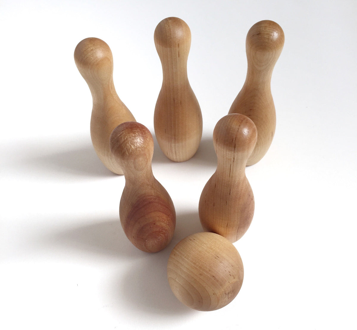 Natural wood bowling set for toddlers with five pins and a ball, perfect Montessori and daycare toy gift.