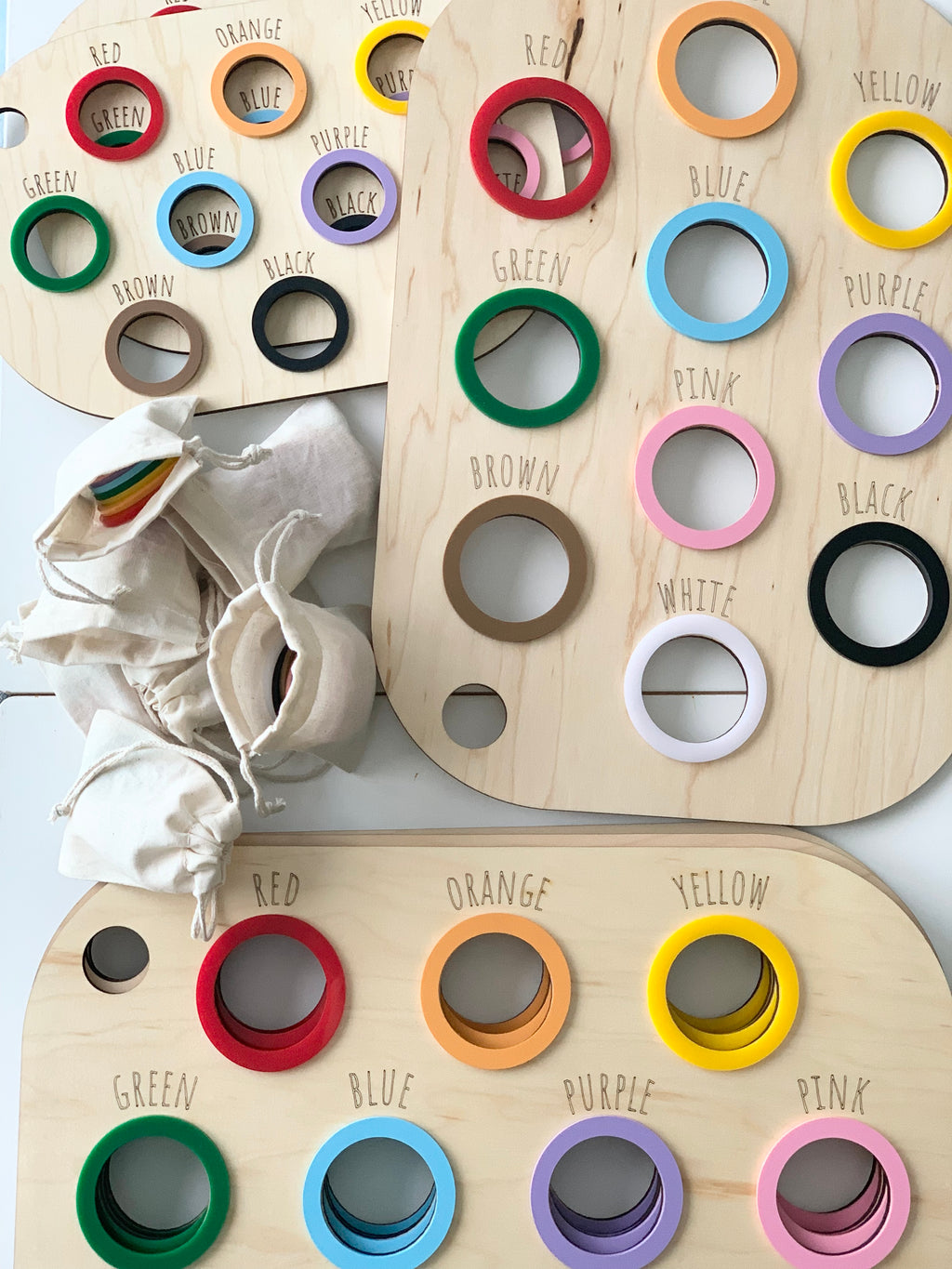 Light natural maple plywood Flisat table bin lids with engraved color names and colored wooden rings for sorting activity