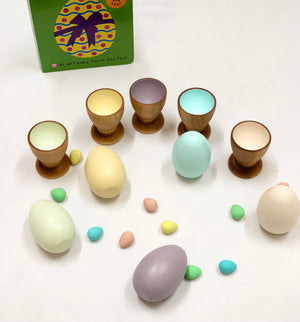 Natural wooden eggs and matching pastel-colored cups Montessori toy for color sorting and fine motor skills development