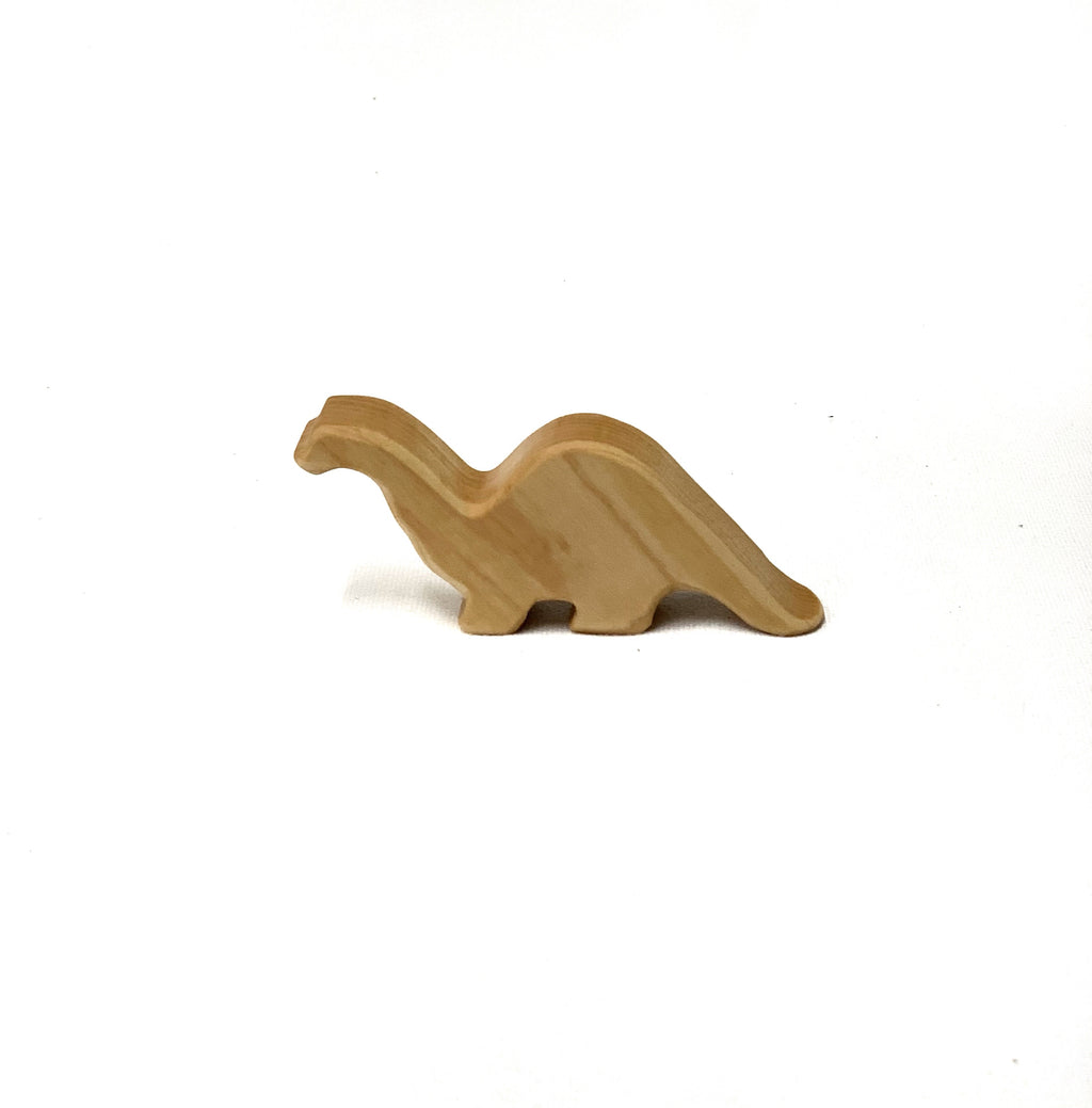 Small baby long neck brachiosaurus wood toy figurine carved from natural light wood on white background