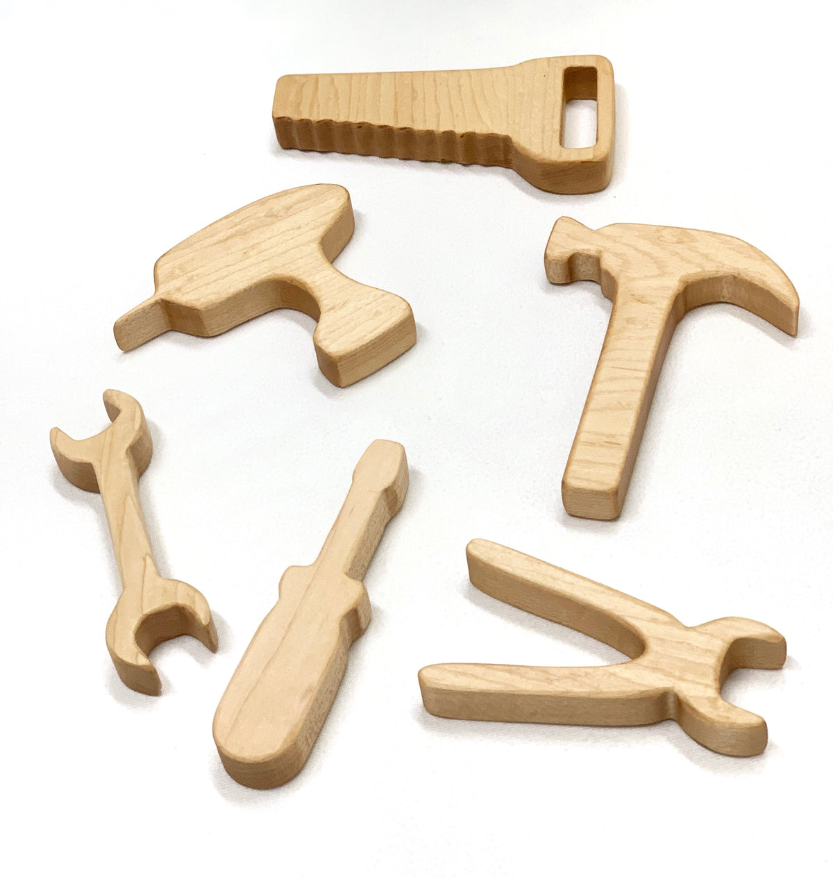 Set of natural wooden toy tools including saw, drill, hammer, wrench, screwdriver, and pliers on white background