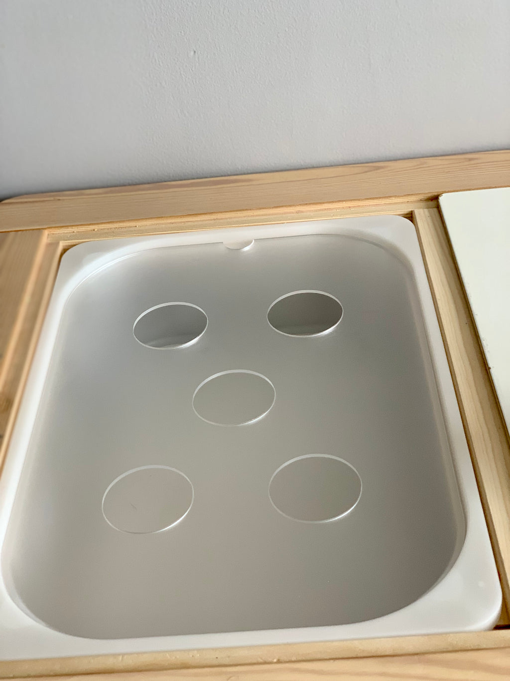 Maple plywood Flisat table top insert with recessed circular cutouts designed to fit Trofast Flisat bins