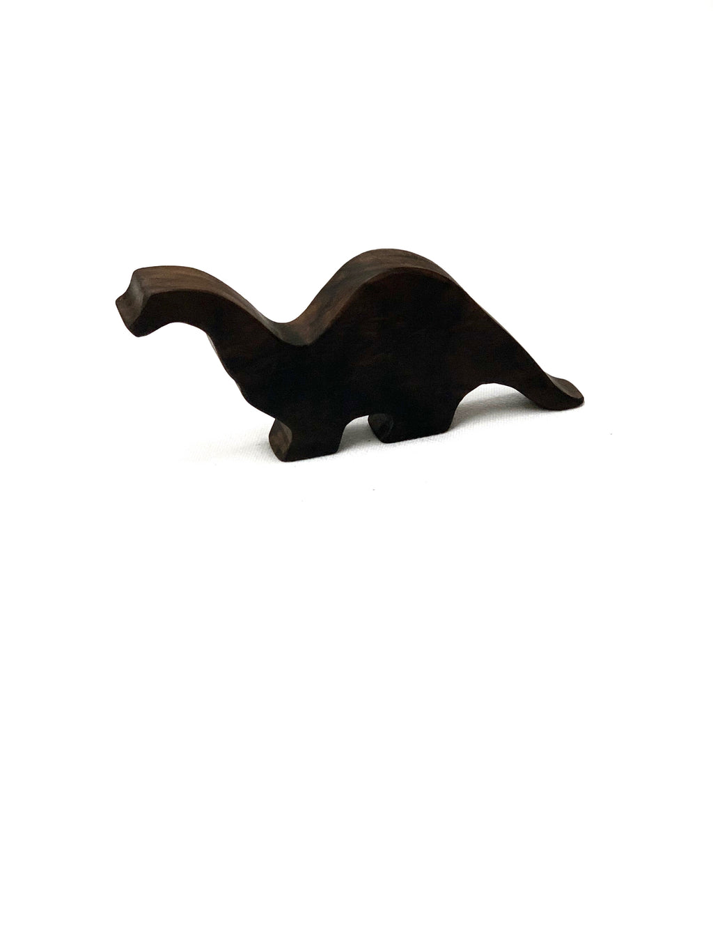 Dark stained wooden long neck brachiosaurus toy figurine on white background