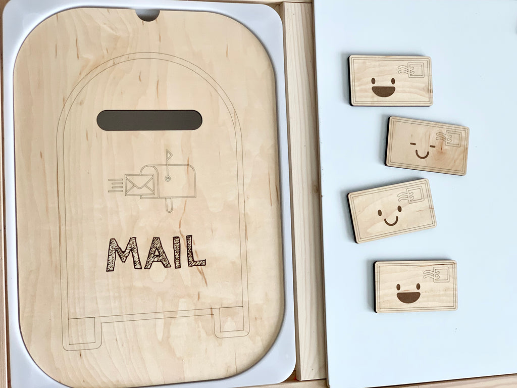 Maple plywood mailbox post table top insert with mail slot and four small wooden envelopes with smiley faces on white surface