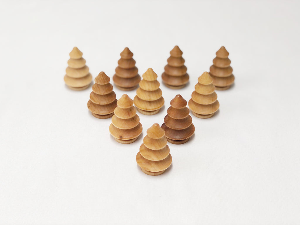 Set of natural wooden trees in various shades for imaginative play and Montessori learning toys.