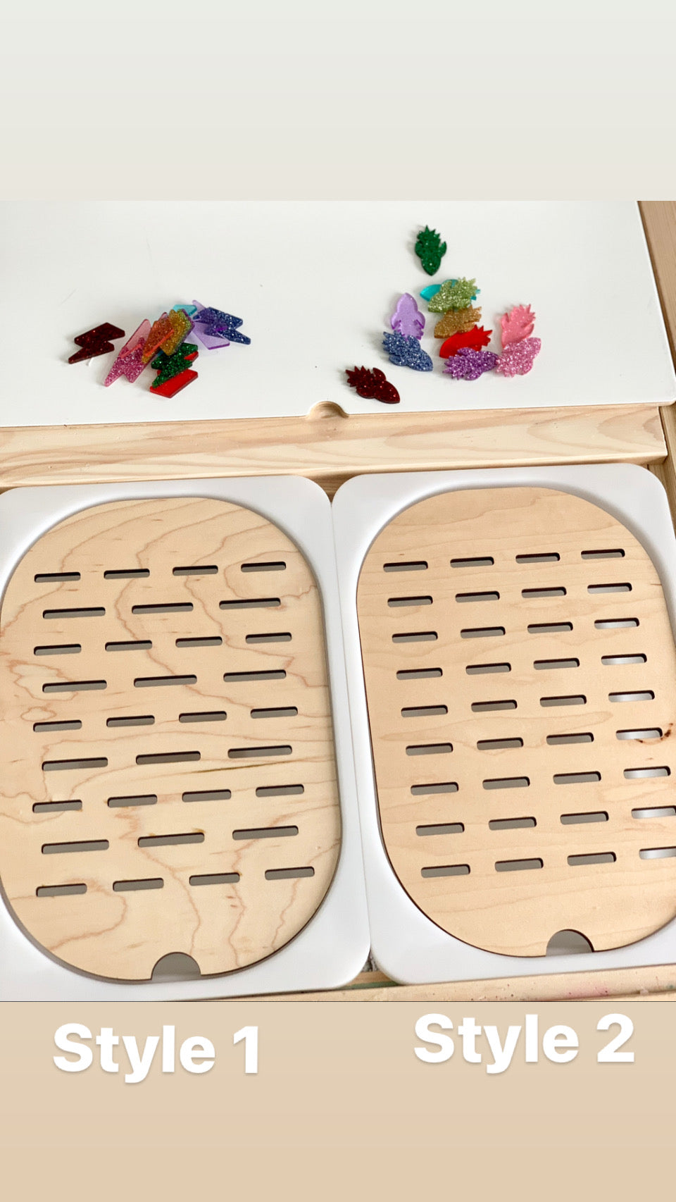Two wooden Flisat table top inserts with slots showing Style 1 and Style 2 with colorful sorting pieces on white surface