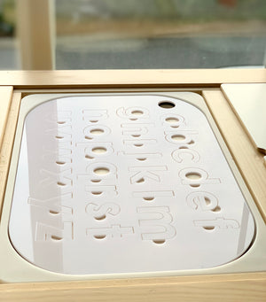 White acrylic lowercase alphabet puzzle insert with maple plywood base fitting Flisat table top with smooth rounded edges