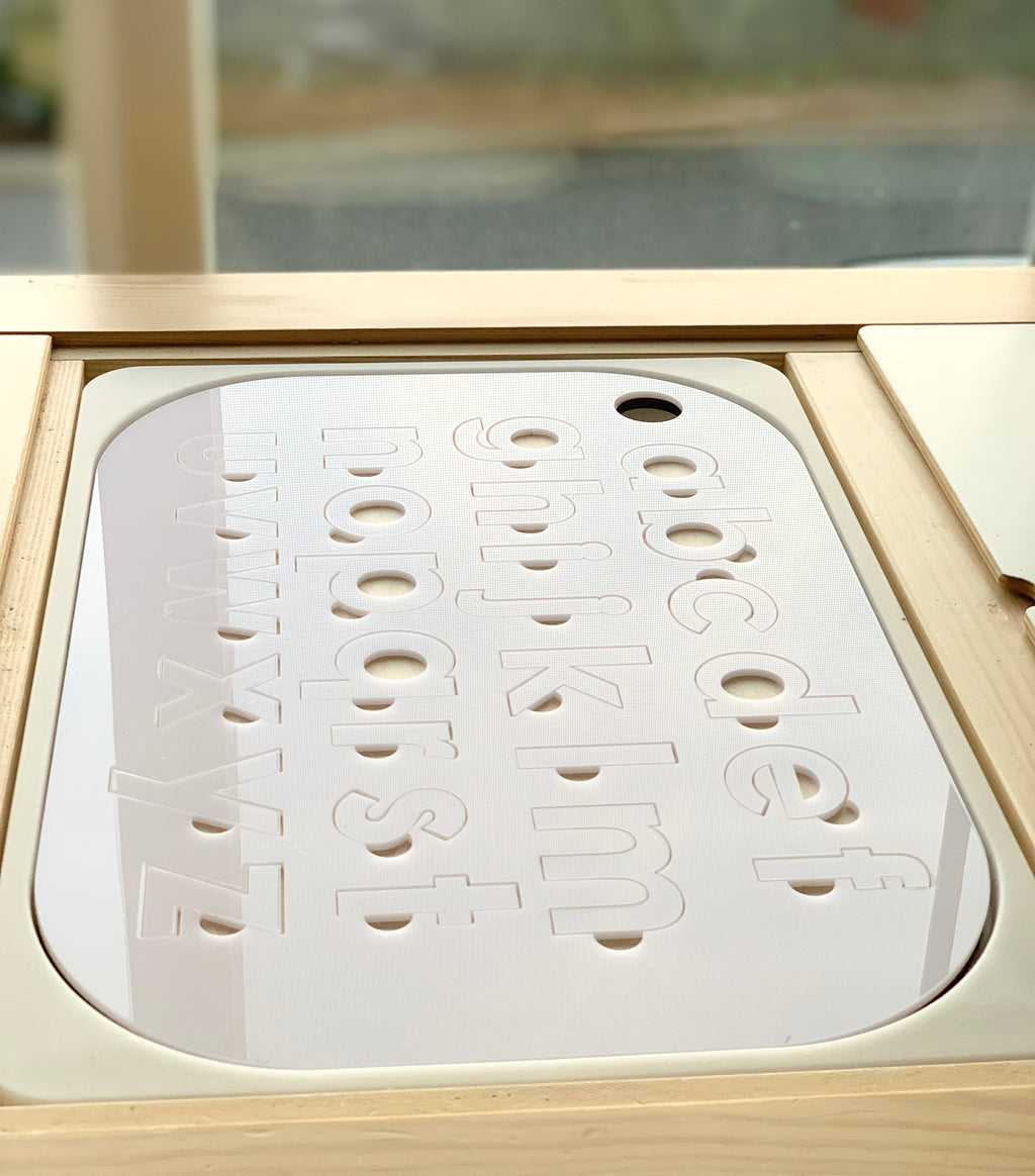 White acrylic lowercase alphabet puzzle insert with maple plywood base fitting Flisat table top with smooth rounded edges