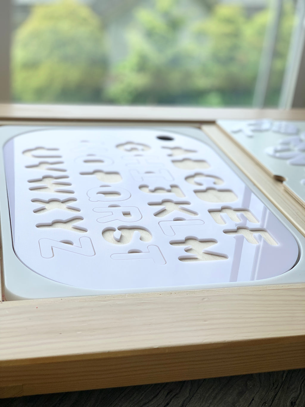 Uppercase alphabet puzzle insert with white acrylic letters set in maple plywood frame for Flisat bins tabletop use