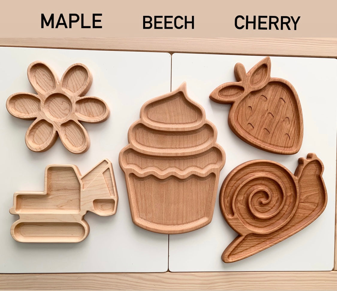 Set of five wooden sensory trays in flower, cupcake, strawberry, excavator, and snail shapes in maple, beech, and cherry woods