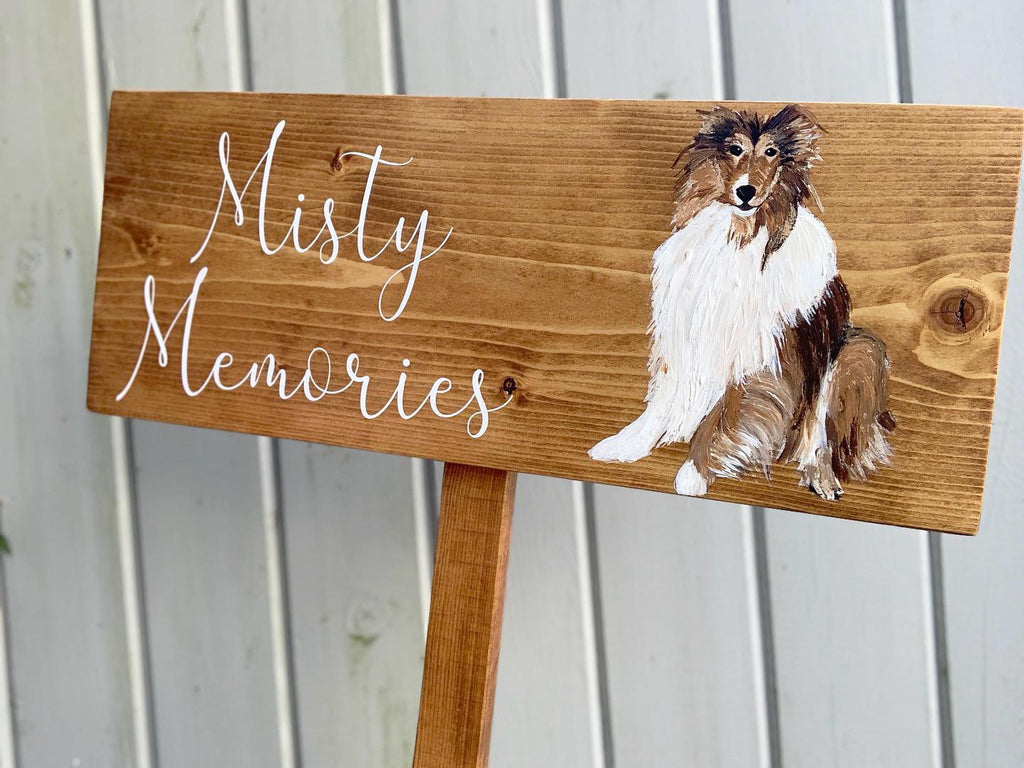 Large custom wooden garden memorial sign with white cursive letters and painted dog illustration on natural wood background