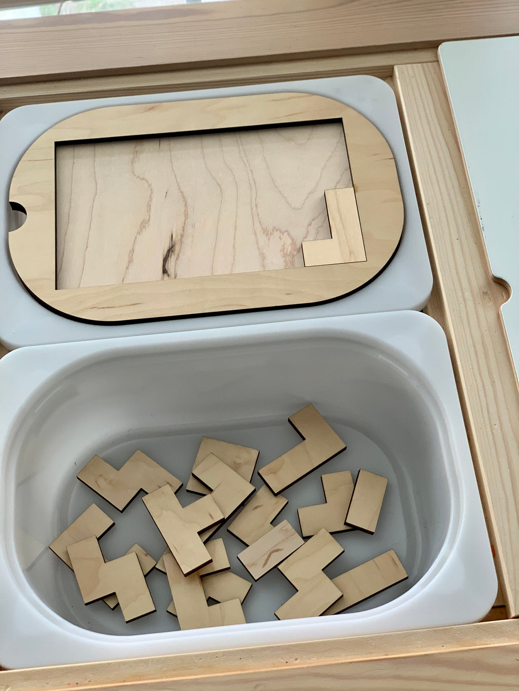 Small wooden puzzle Flisat table top insert with natural wood pieces inside white plastic bin tray