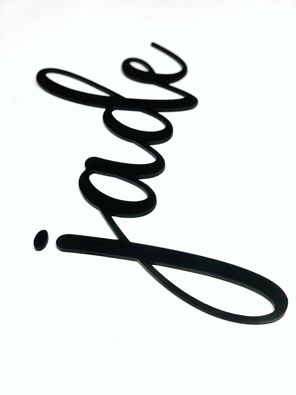 Black custom word cutout in cursive script spelling "jade" on white background with smooth edges