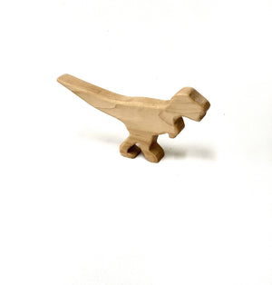 Small natural wood T Rex dinosaur toy figurine with smooth edges on white background