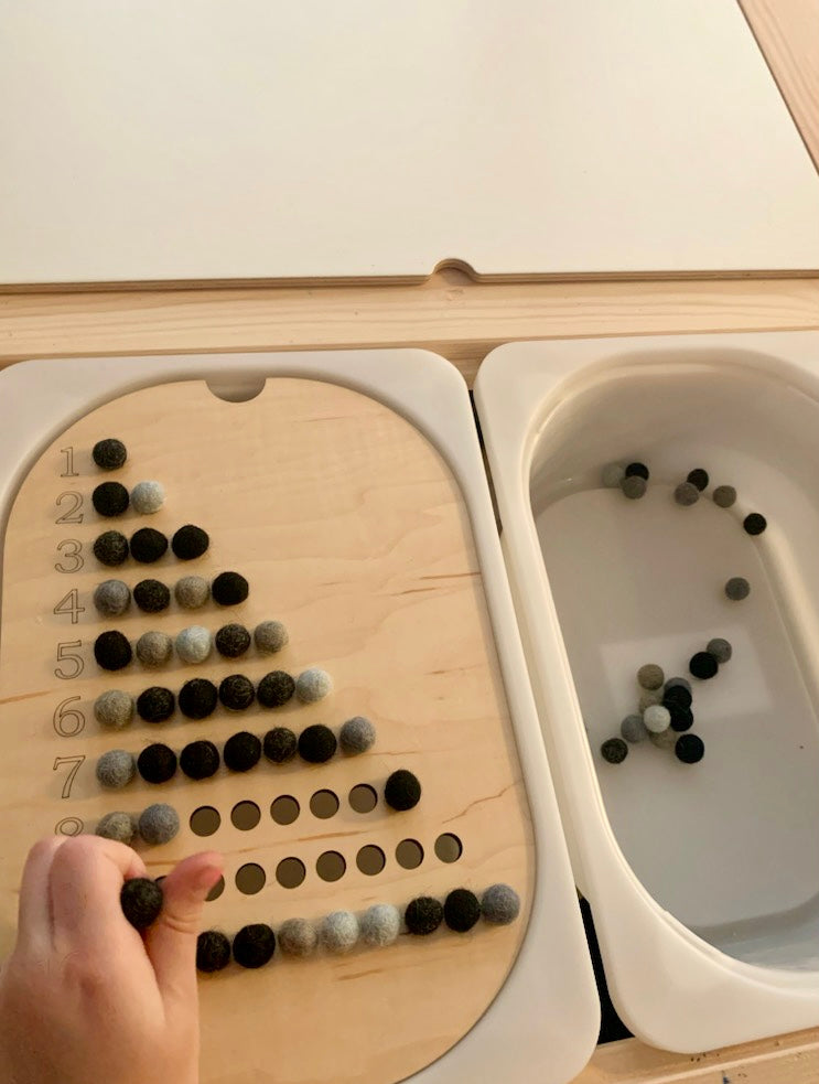 Maple plywood Flisat table top insert with numbered rows and black and gray counting balls for learning numbers 1-10