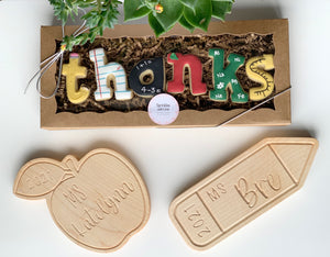 Personalized colorful wooden name sign with educational themed letters in box and engraved wooden apple and pencil plaques