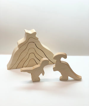Natural unfinished wooden dinosaur toy figurines with layered volcano puzzle on white background