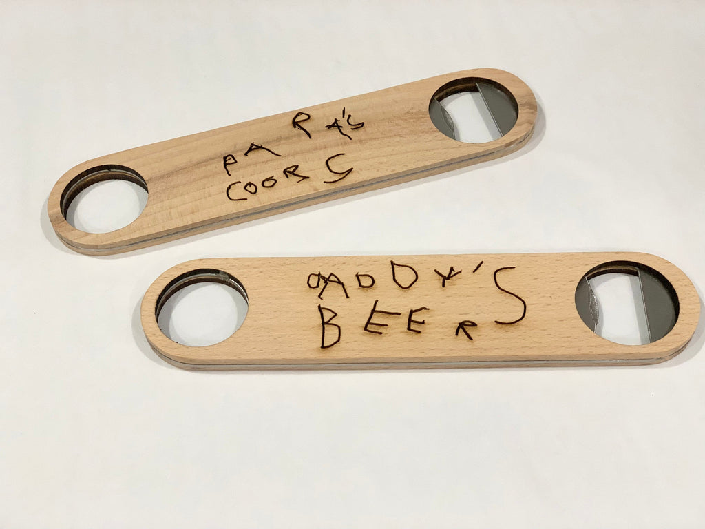 Custom wooden bottle openers with personalized handwritten text engraved on natural wood surface with metal opener ends